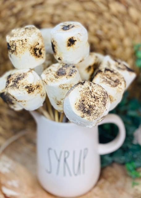 Faux Marshmallows with a skewer, toasted fake marshmallow